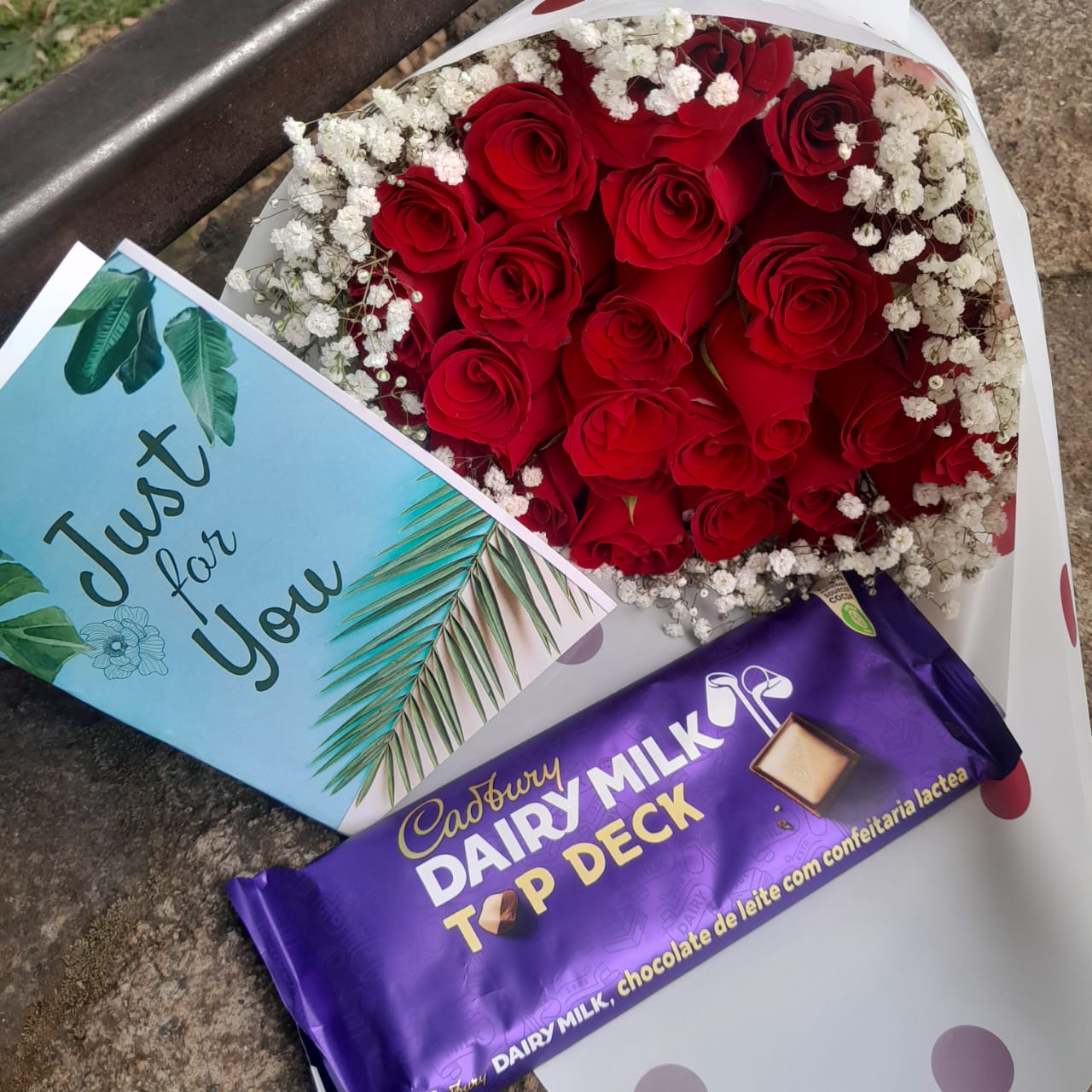 RED ROSES WITH A LARGE CADBURY CHOCOLATE