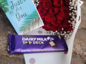 RED ROSES WITH A LARGE CADBURY CHOCOLATE