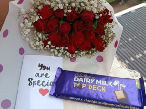 RED ROSES WITH A LARGE CADBURY CHOCOLATE
