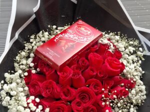 RED ROSES WITH FULL RIM BABY BREATH & LINDT LINDOR CHOCOLATE