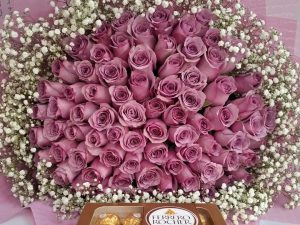 100 PURPLE ROSES WITH BABY BREATH