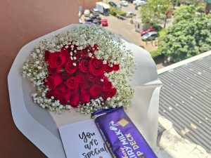 RED ROSES WITH A LARGE CADBURY CHOCOLATE