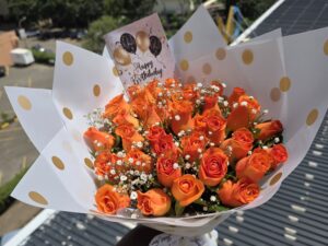 ORANGE ROSES WITH BABY BREATH