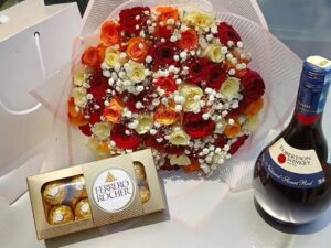 MIXED ROSES BOUQUET WITH FERRERO ROCHER CHOCOLATES & RED WINE
